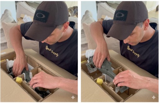 A person lifting an aircraft model from a box by the fuselage