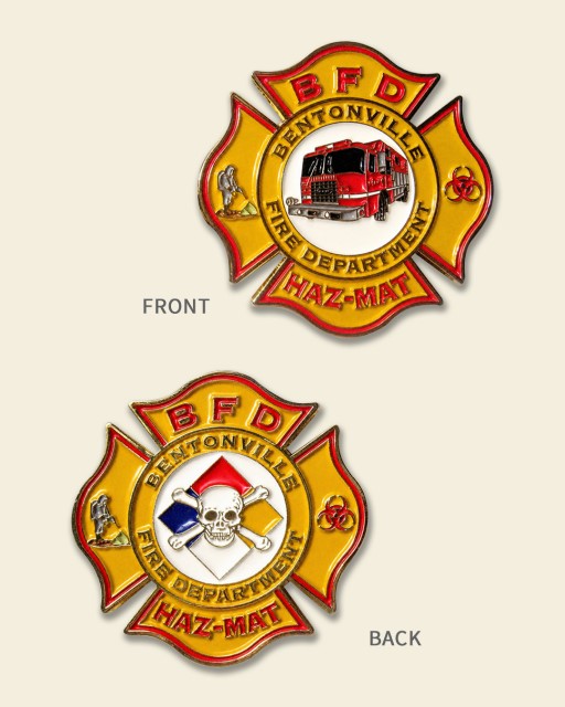 Bentonville Fire Department HAZ-MAT firefighter challenge coin showing hazard symbol and skull design on front and fire truck on back.