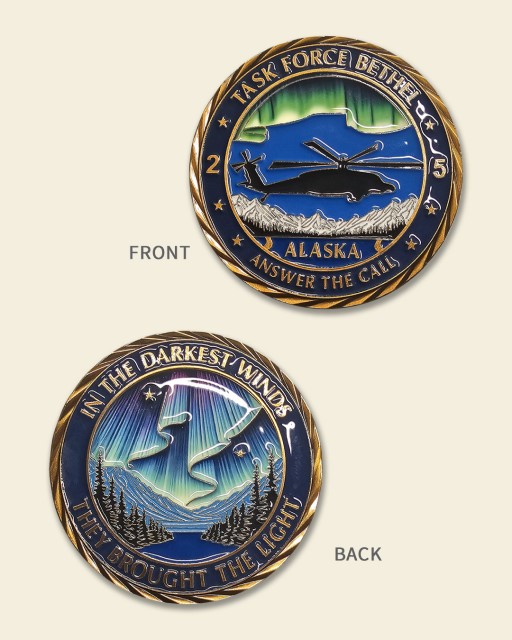 Task Force Bethel Alaska challenge coin featuring helicopter, aurora borealis, mountain range, and motto text with raised gold edge and enamel colors.