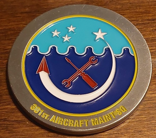 301st AMXS Anniversary coin front with crescent, tools, stars, and unit text