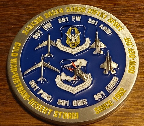 301st AMXS Anniversary coin back with Air Force emblems, aircraft silhouettes, and unit text