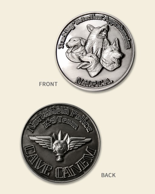 Front and back of Northfield Police K9 Team challenge coin featuring detailed dog artwork and Latin motto CAVE CANEM.