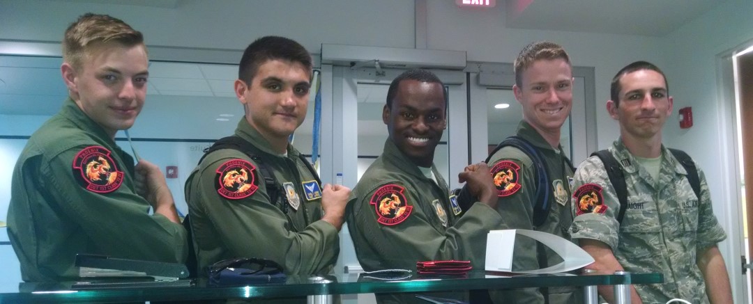 Group wearing matching AFROTC Det 157 Embry-Riddle patches showing teamwork and unit pride