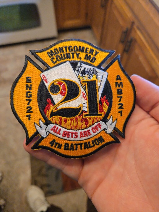 Embroidered Montgomery County Fire and Rescue Service patch with Maltese cross, flames, and motto All Bets Are Off