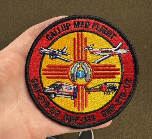 Guardian Flight Gallup Med EMS embroidered patch showing aircraft, ambulance, and Zia symbol of New Mexico.