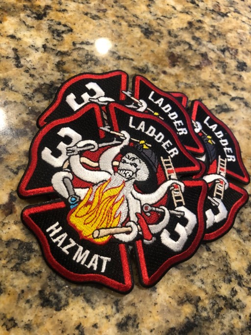 Embroidered Truckee Meadows Fire Rescue Ladder Hazmat 33 patch with Maltese cross, skull, flames, and crossed axes