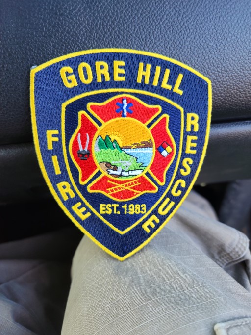 Embroidered Gore Hill Fire Rescue patch with Maltese cross, flame, and landscape design symbolizing quality craftsmanship