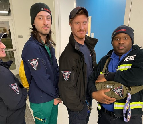 Mecklenburg County EMS personnel wearing uniforms featuring custom triangular EMS patches.
