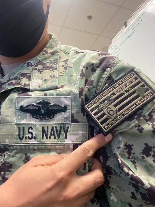 NEPMU 6 NWU Type III patch on Navy uniform sleeve with text Protection Through Prevention