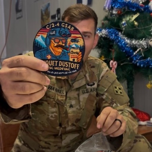 Charlie Company 2‑4th GSAB MEDEVAC Banquet Dustoff embroidered patch held by a soldier in uniform