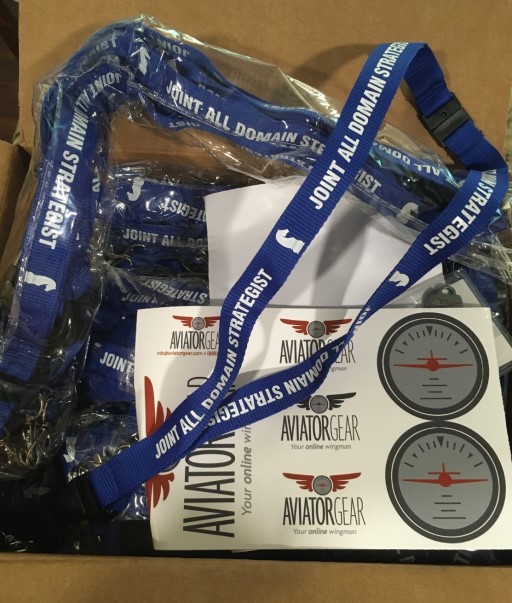 Box of blue lanyards with JOINT ALL DOMAIN STRATEGIST
