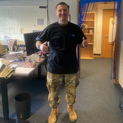 Air Force squadron member wearing 492 FGS custom military t shirt in a real-world setting