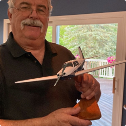 gallery image of another satisfied customer holding a low wing GA aircraft model
